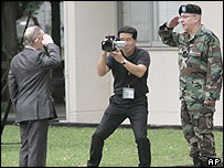 Charles Jenkins, left, salutes US military police officer Paul Nigara